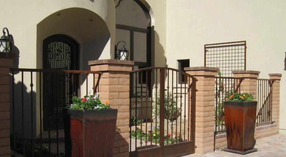Iron Gate With Desert Adapted Container Plants Iron Gate With Desert Adapted Container Plants