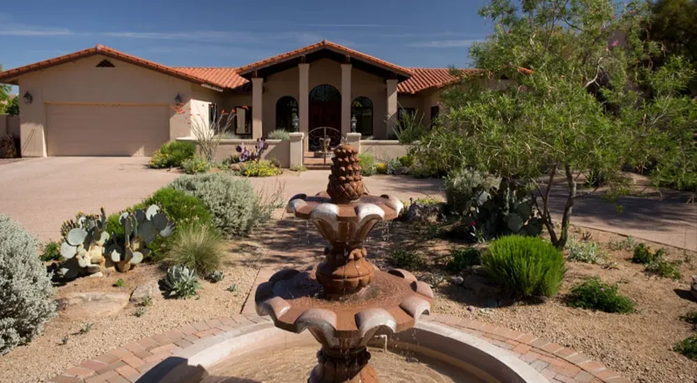 Desert front yard with fountain and xeriscape plants Desert front yard with fountain and xeriscape plants