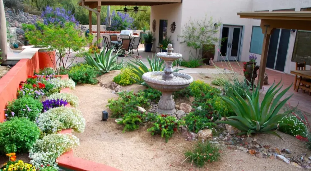 Desert garden with fountain and succulents Desert garden with fountain and succulents
