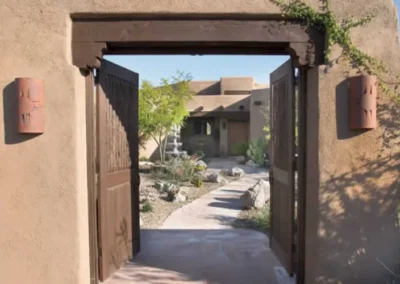 Adobe Home Wooden Gate Entrance Pathway With Desert Garden Design