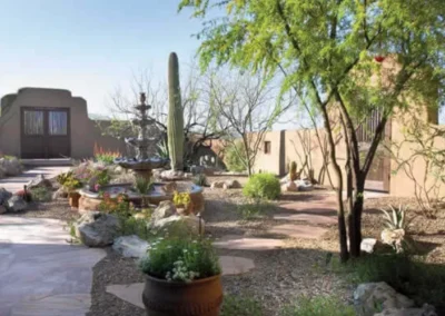 Desert Landscaping With Potted Succulents And Agave