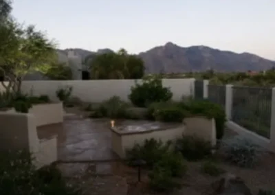 Elegant Outdoor Living Area With Fireplace And Scenic Mountain Views