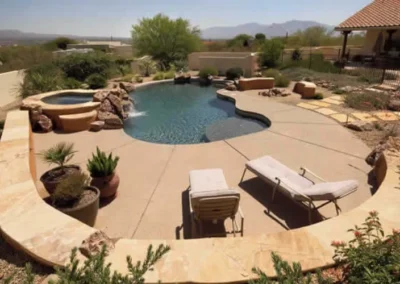 Luxury Backyard Pool With Curved Retaining Walls And Desert Landscaping