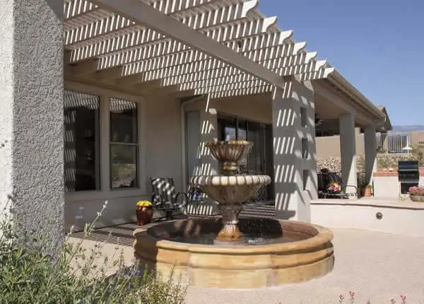 Outdoor fountain water feature under pergola Tucson Arizona landscape design