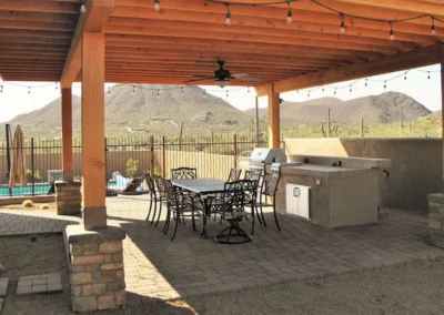 Covered dining patio with desert landscaping Tucson