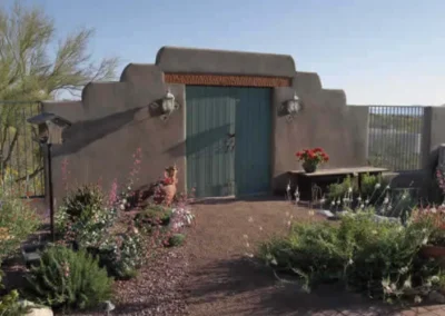 Southwestern Adobe House Blue Wooden Door With Desert Garden Landscaping