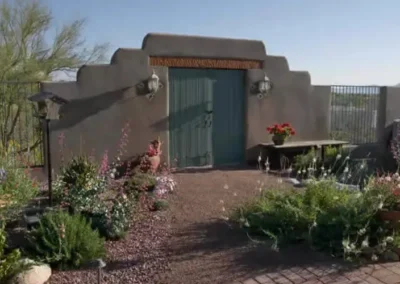Southwestern Gate With Flowering Xeriscape In Tucson
