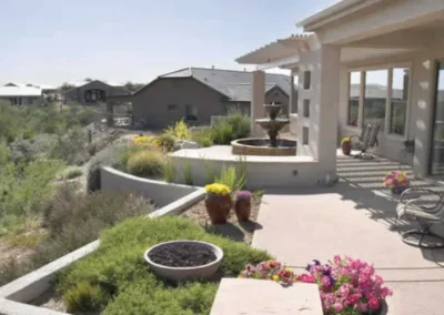 Southwestern Patio With Curved Wall, Fountain Feature, And Desert Plants