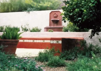 Southwestern Stucco Seating Wall With Built In Bench And Fountain Feature