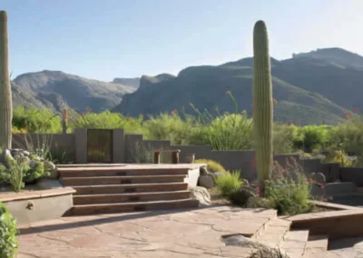 Stone Steps With Desert Plants, Cacti, And Mountain Landscape View