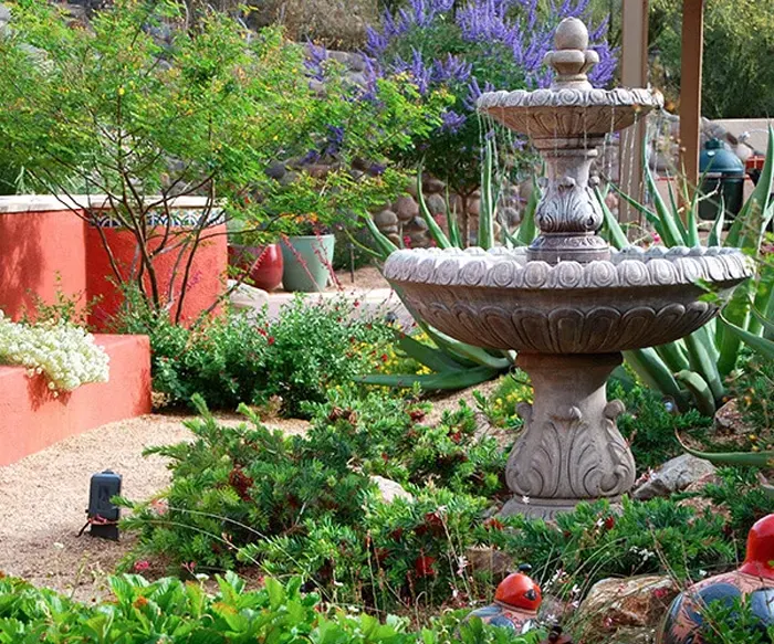 Decorative garden fountain in desert landscape