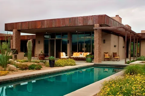 Modern desert home with pool and landscaped yard