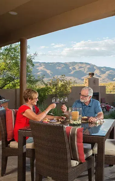 Couple enjoying dinner on outdoor patio