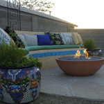 Fire bowl and seat bench on flagstone patio