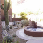 Custom fountain with tiled masonry basin and xeriscape plantings